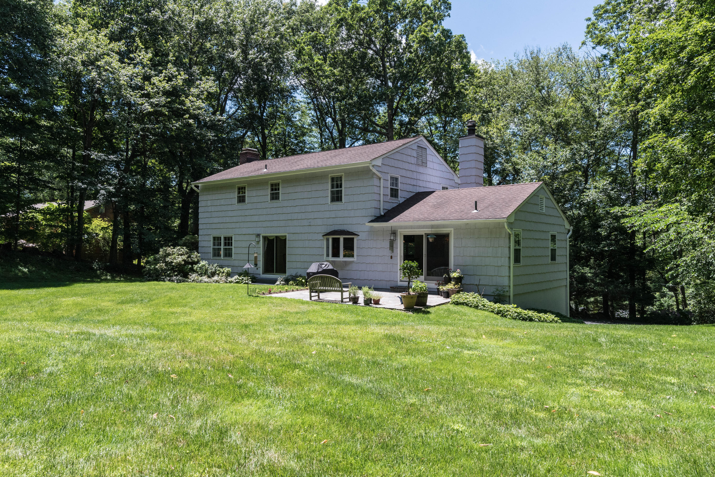 24 Hannahs Road Stamford, CT 06903 - Photo 25 of 28 a front view of house with yard and trees