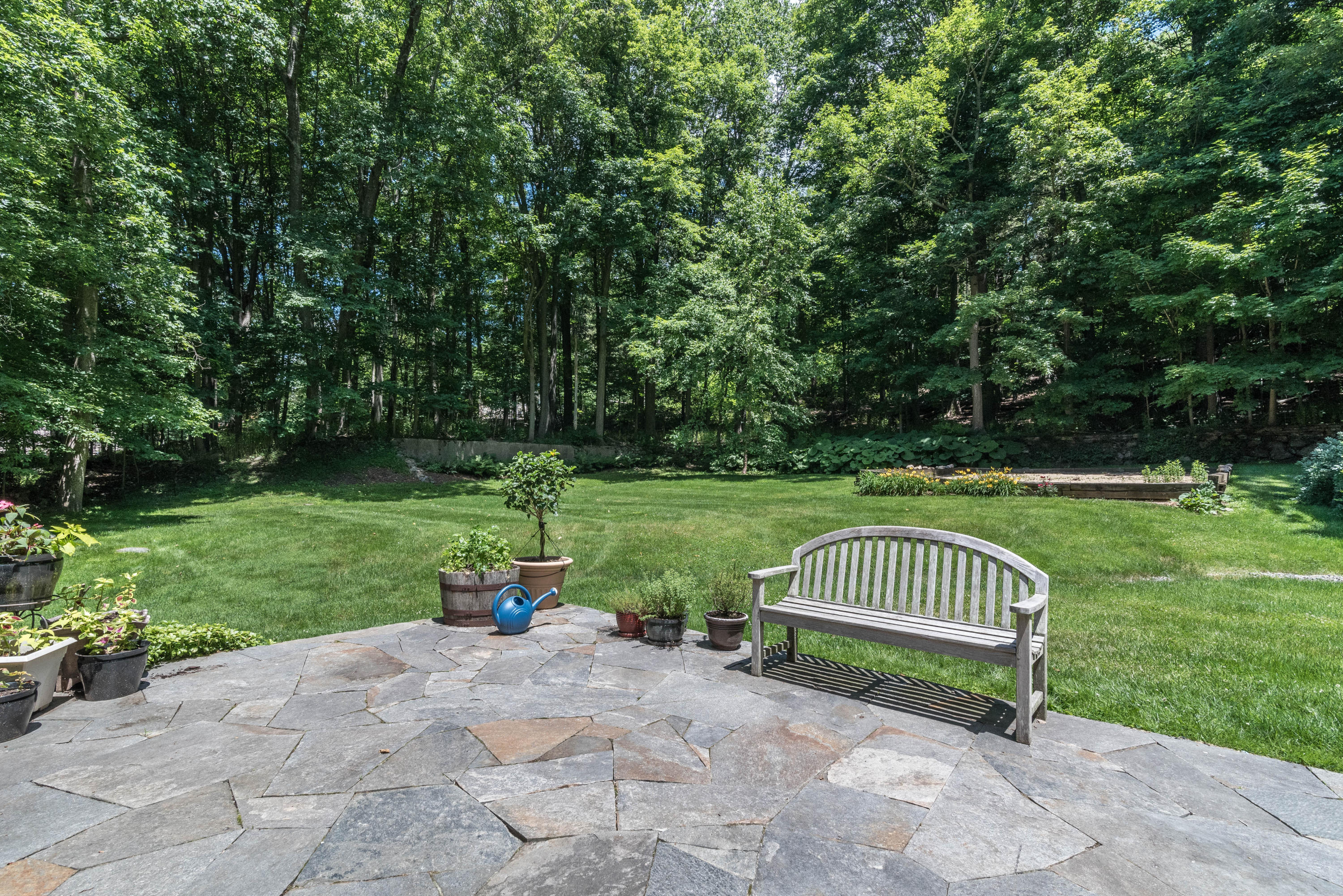 24 Hannahs Road Stamford, CT 06903 - Photo 26 of 28 a park view with a bench and trees