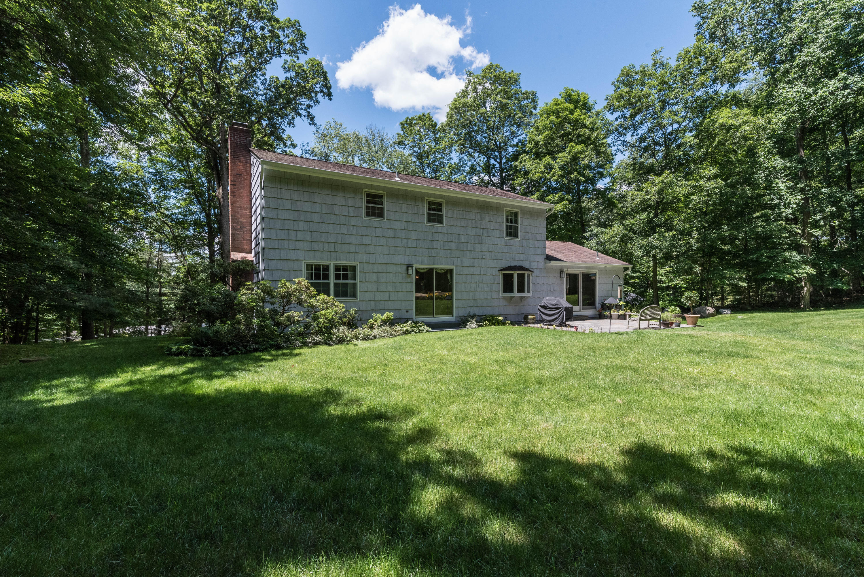 24 Hannahs Road Stamford, CT 06903 - Photo 27 of 28 a view of a house with backyard