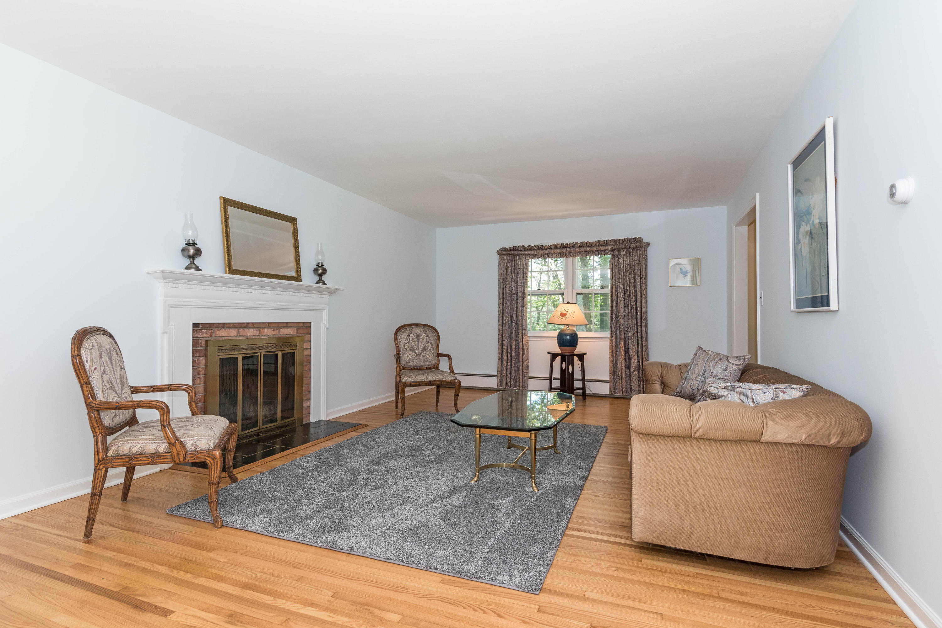 24 Hannahs Road Stamford, CT 06903 - Photo 4 of 28 a living room with furniture and a fireplace