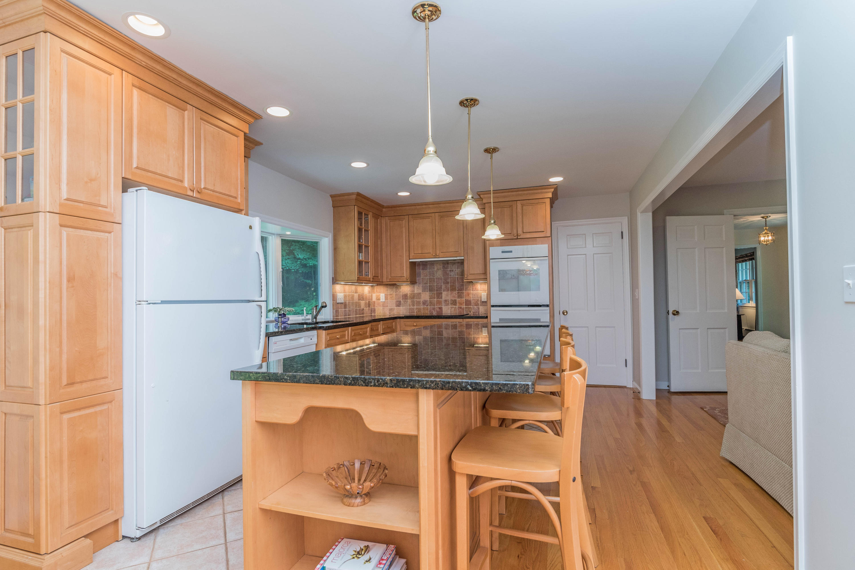 24 Hannahs Road Stamford, CT 06903 - Photo 9 of 28 a kitchen with stainless steel appliances granite countertop a refrigerator a oven and a sink with wooden floor
