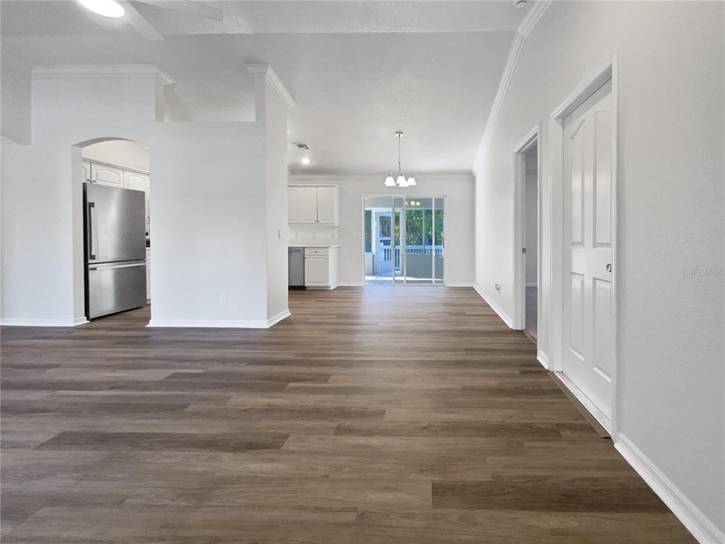 3053 Draper Terrace North Port, FL 34286 - Photo 13 of 31 a view of an empty room with wooden floor and a window
