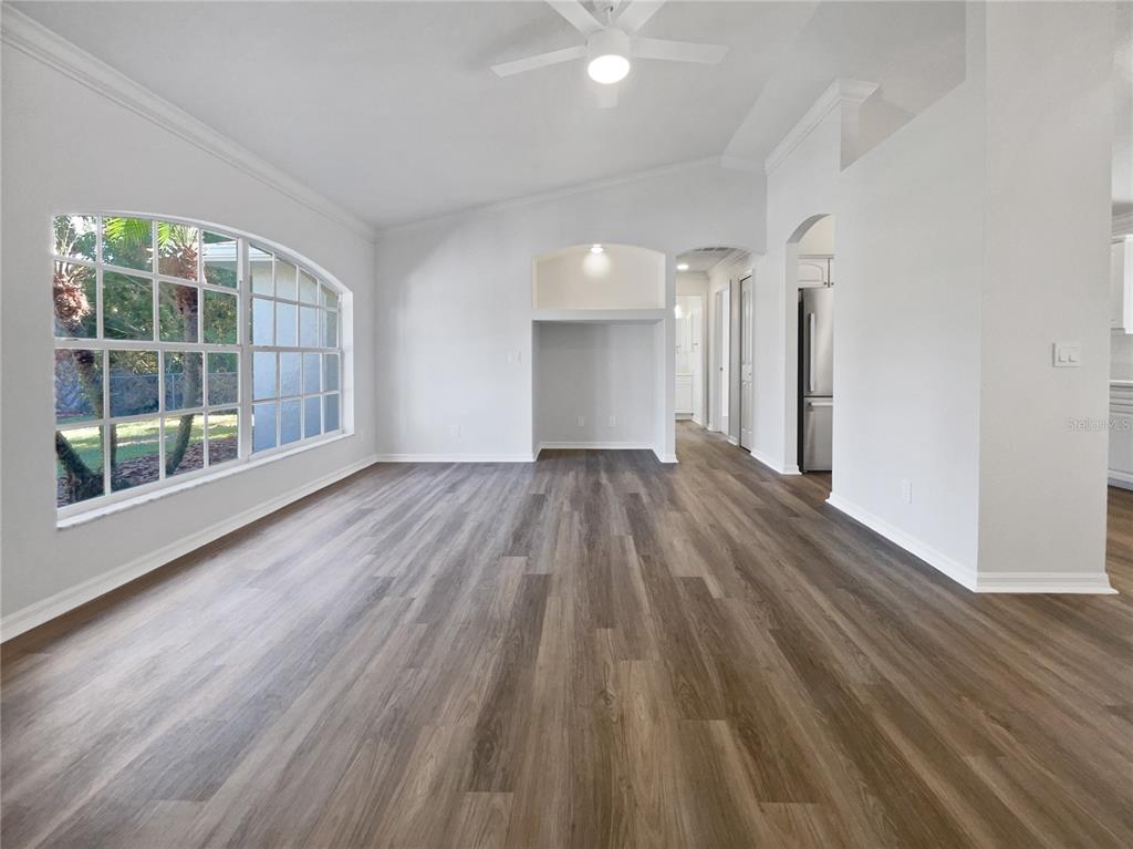 3053 Draper Terrace North Port, FL 34286 - Photo 15 of 31 wooden floor in an empty room with a window