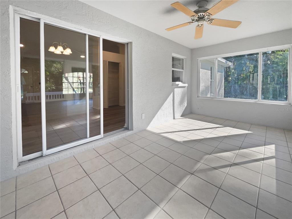 3053 Draper Terrace North Port, FL 34286 - Photo 21 of 31 a very nice looking room with a large window and chandelier
