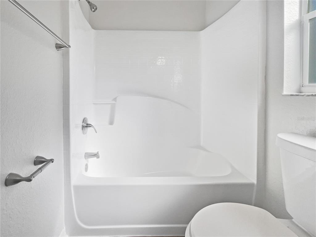 3053 Draper Terrace North Port, FL 34286 - Photo 27 of 31 a bathroom with a toilet and a bathtub
