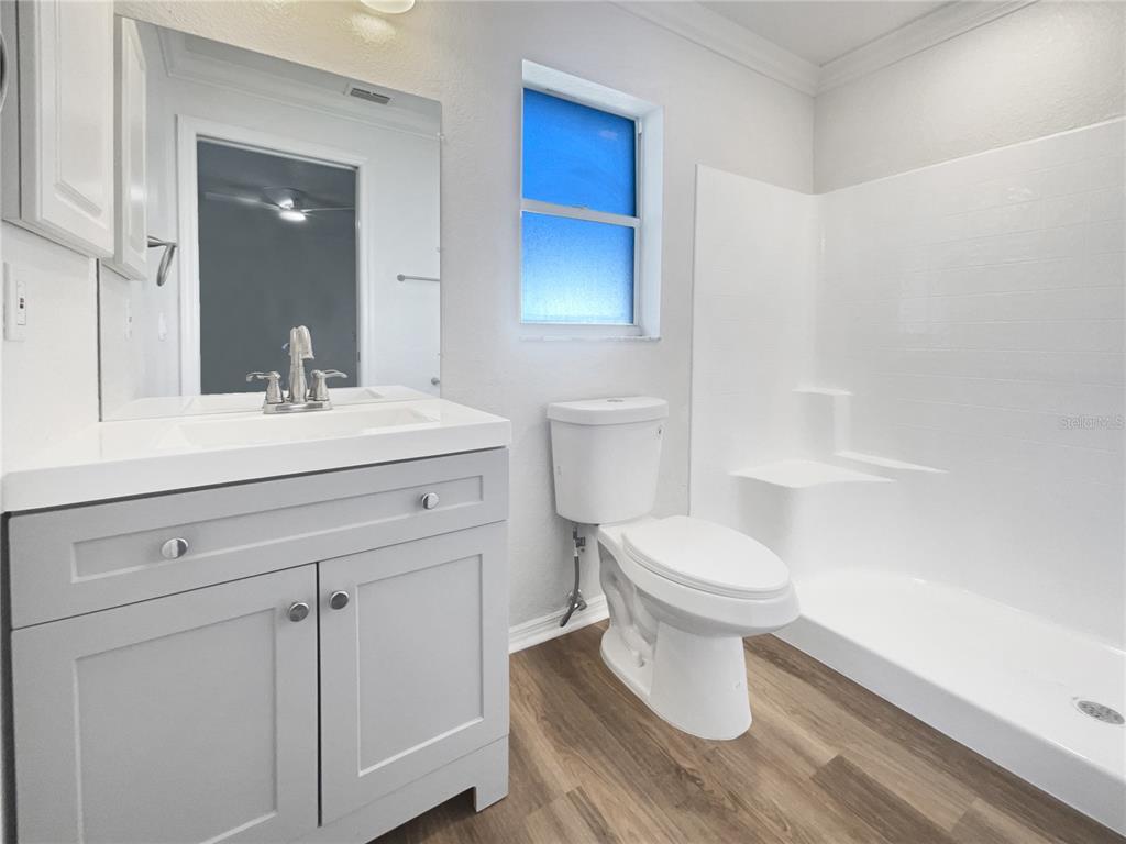 3053 Draper Terrace North Port, FL 34286 - Photo 7 of 31 a bathroom with a sink toilet and vanity