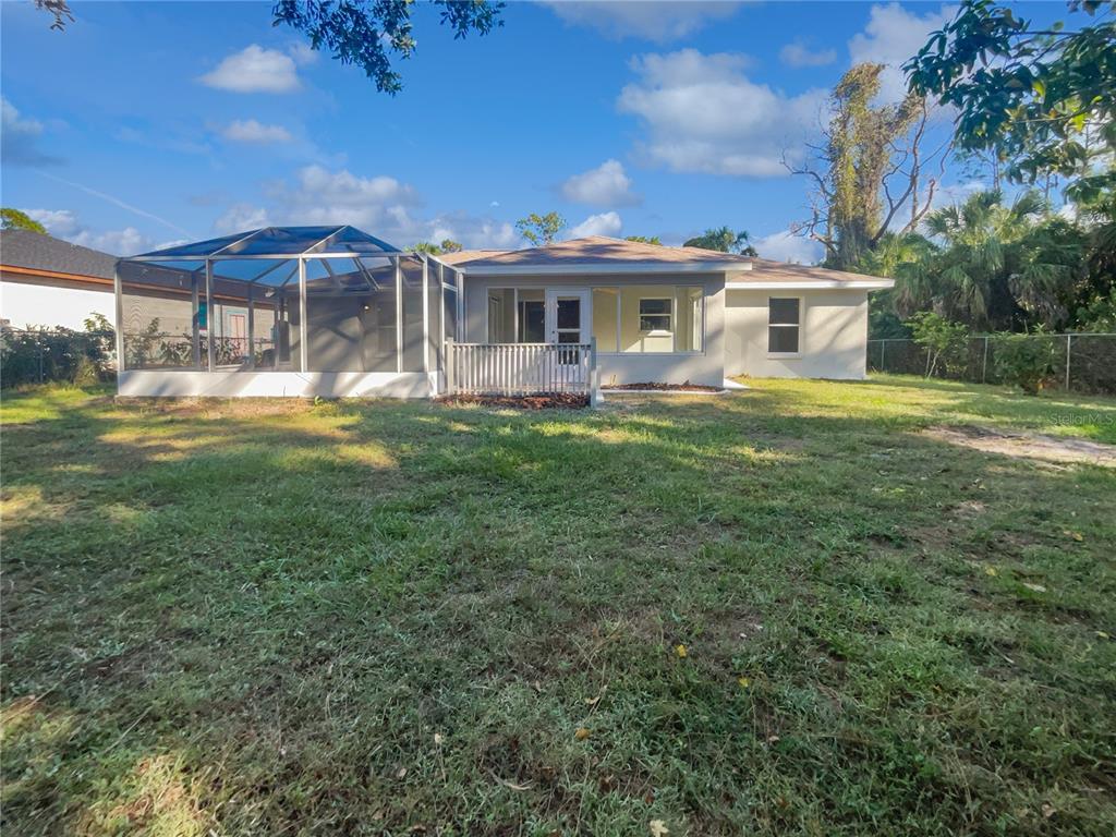 3053 Draper Terrace North Port, FL 34286 - Photo 8 of 31 a front view of a house with a garden