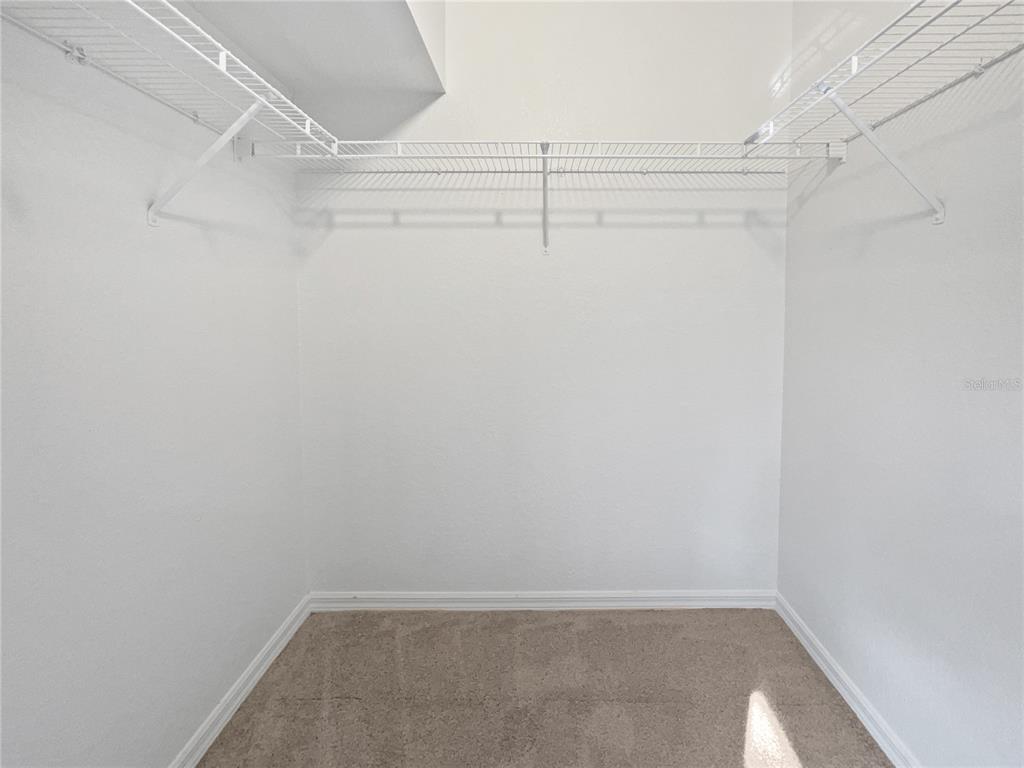 3053 Draper Terrace North Port, FL 34286 - Photo 10 of 31 a view of a room with racks on the wall