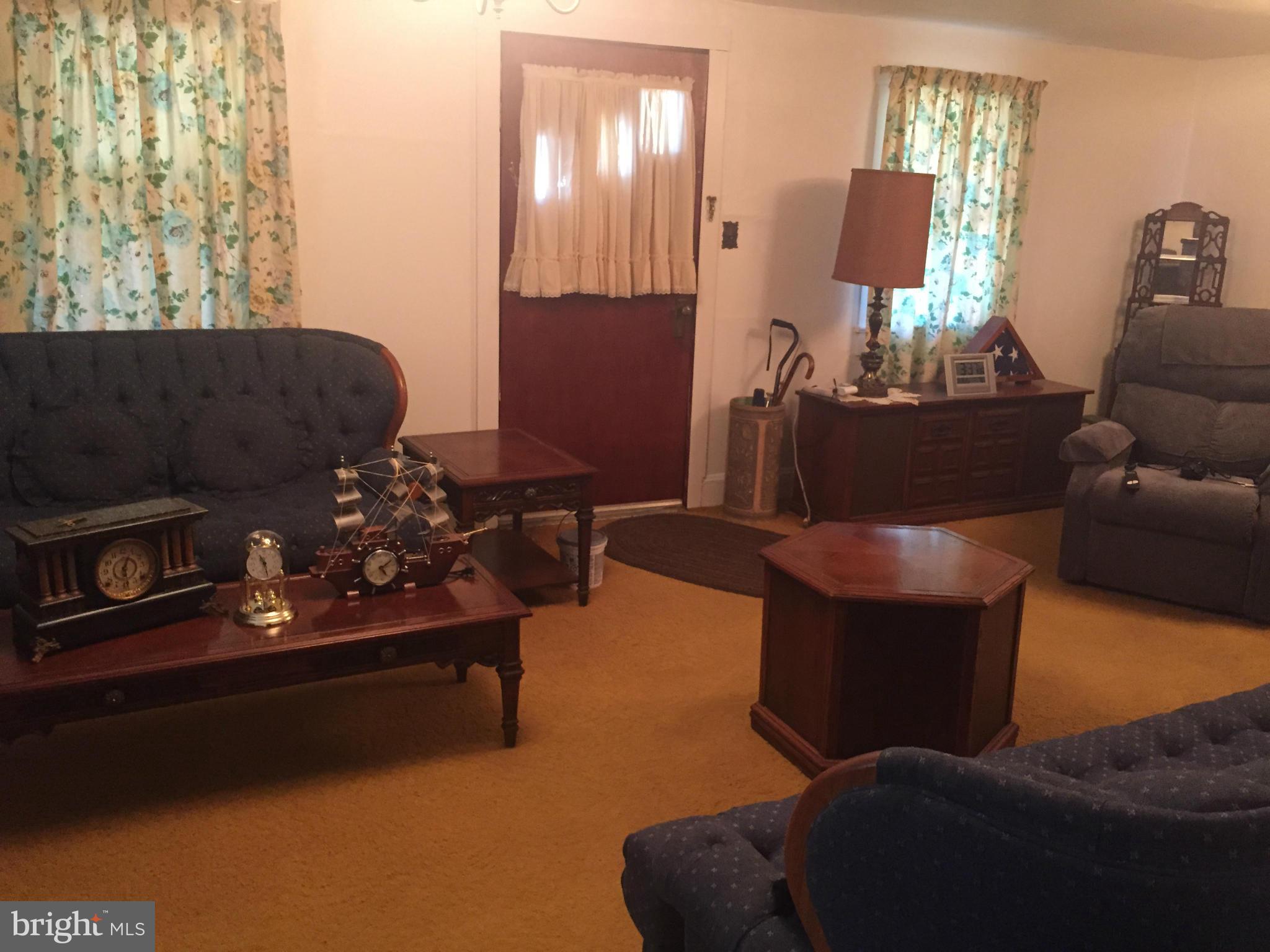 106 North Reymann Street Ranson, WV 25438 - Photo 5 of 17 a living room with furniture flowerpot and a lamp