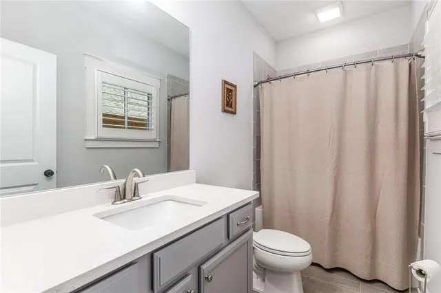 a livingroom with workspace and a window