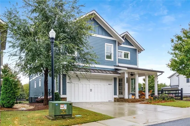 a view of a porch with furniture and garden
