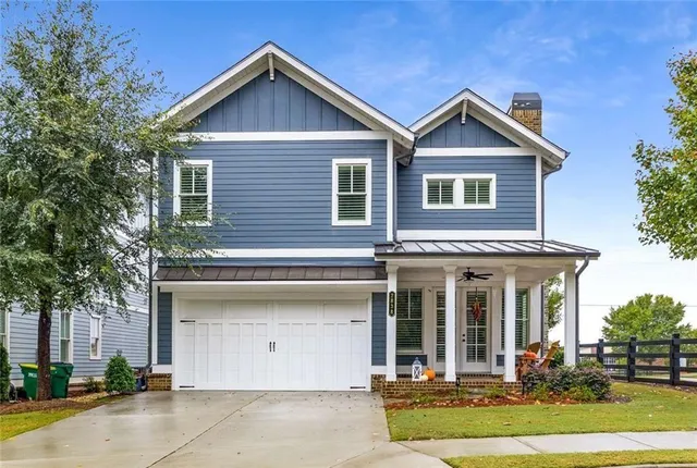 a view of swimming pool with outdoor seating and a garden