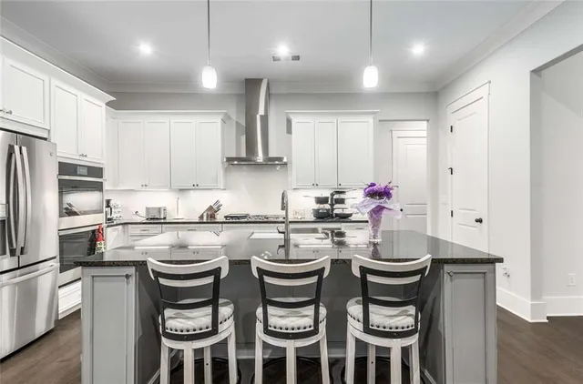 a kitchen with a sink and white appliances