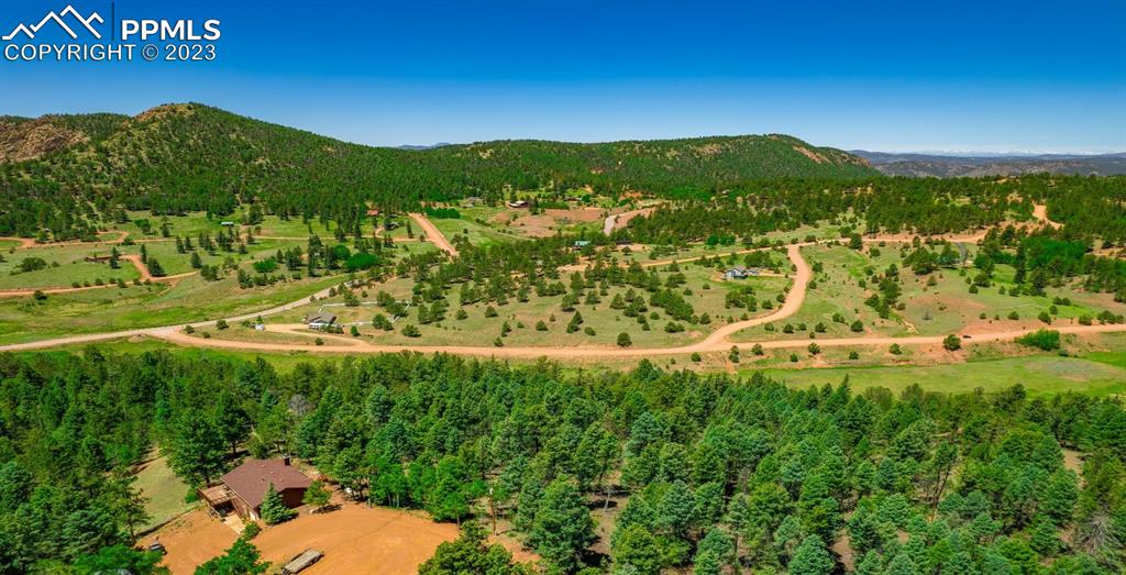 55 Summit Circle Cripple Creek, CO 80813 - Photo 5 of 5 a view of a lush green hillside and houses