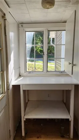 a sink sitting in a bathroom next to a window