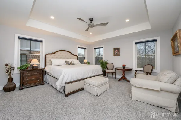 a bedroom with bed and a couch