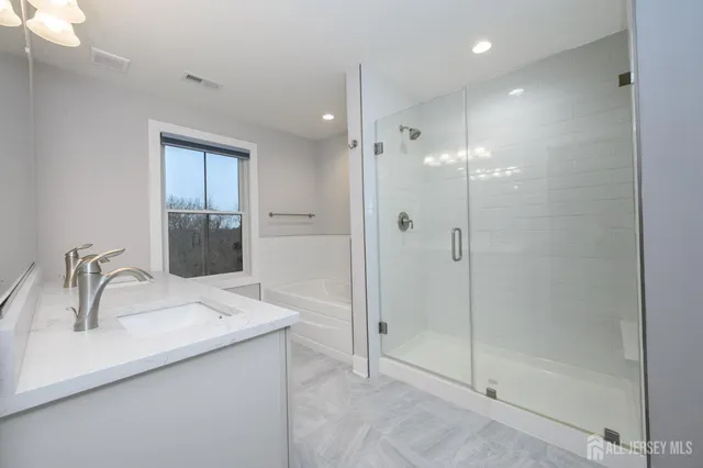 a bathroom with a sink and mirror