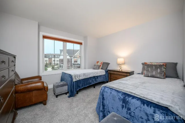 a bedroom with a bed and a lamp