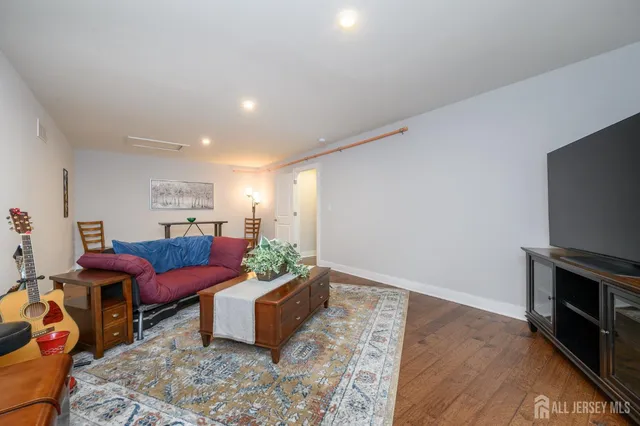 a balcony with wooden floor outdoor seating and city view