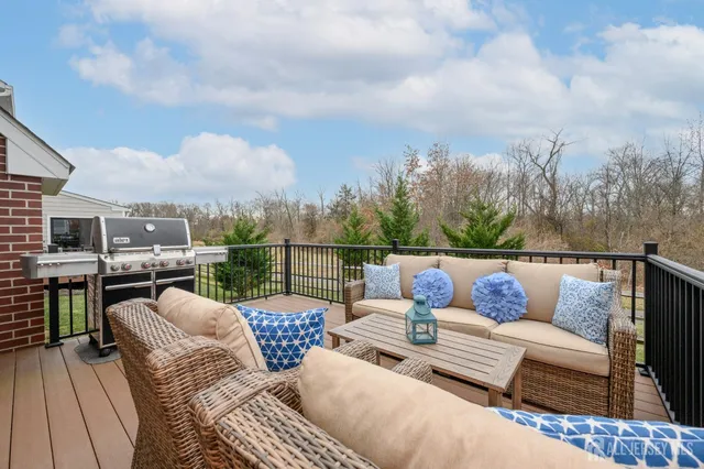 a view of a patio with couches chairs and a table and chairs
