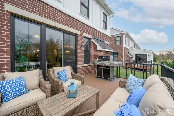 a view of a house with a yard and sitting area