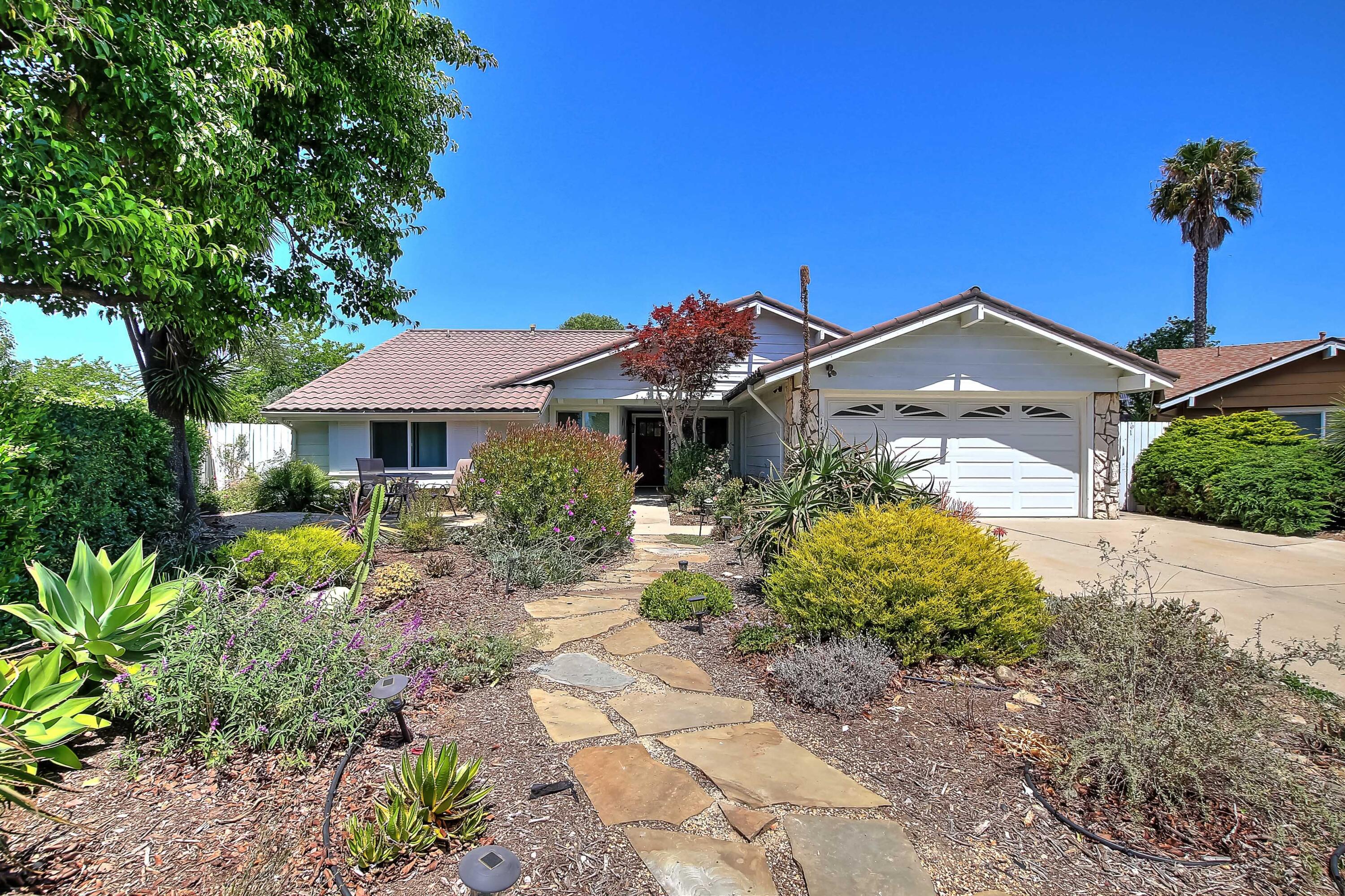 159 Alpine Drive Goleta, CA 93117 - Photo 1 of 3 a front view of a house with a yard and potted plants