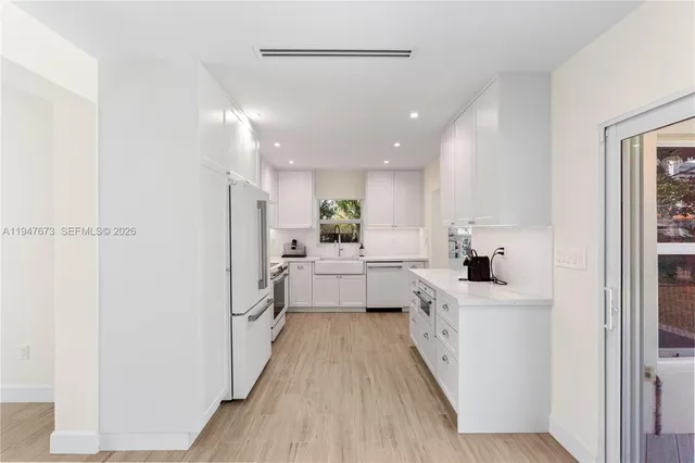 a large kitchen with a lot of counter space