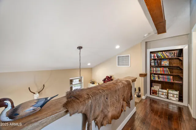 a living room with a book shelf