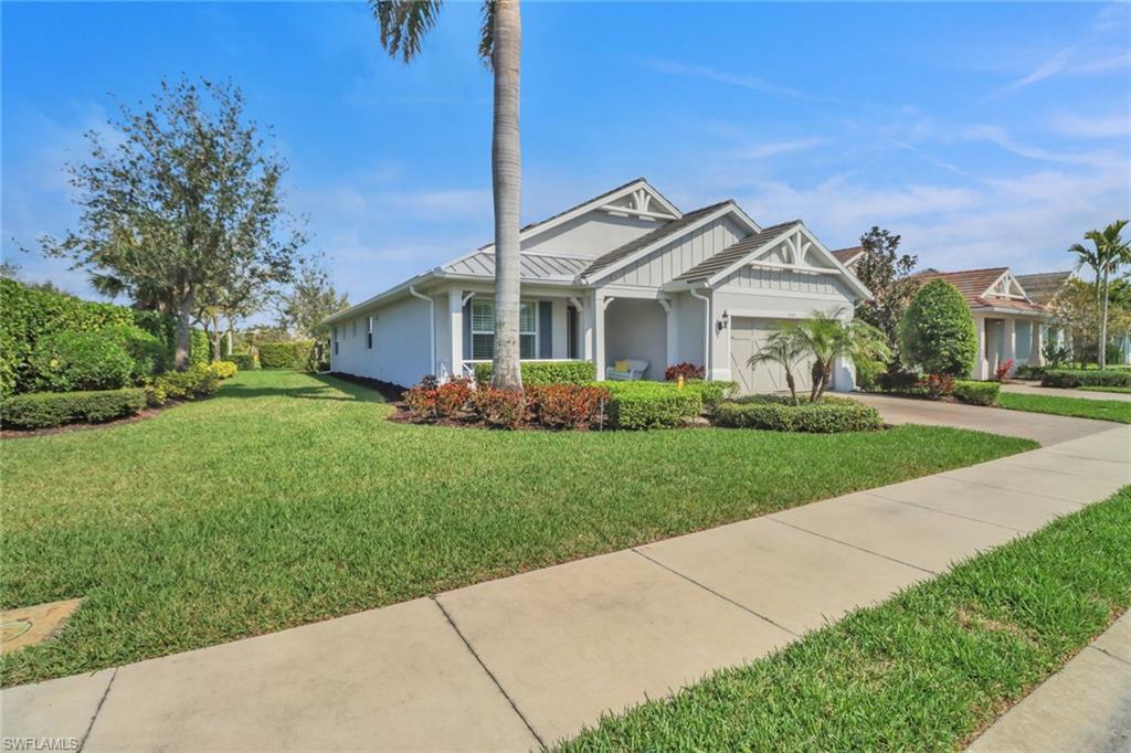 10588 Jackson Square Drive Estero, FL 33928 - Photo 2 of 50 a front view of house with yard and green space