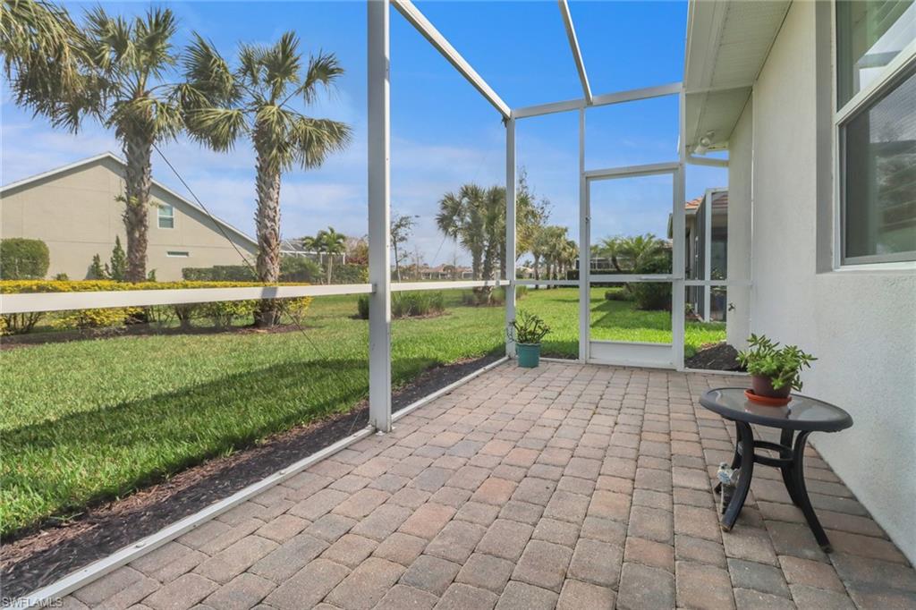 10588 Jackson Square Drive Estero, FL 33928 - Photo 25 of 50 a view of a chair and table in backyard with a small pool