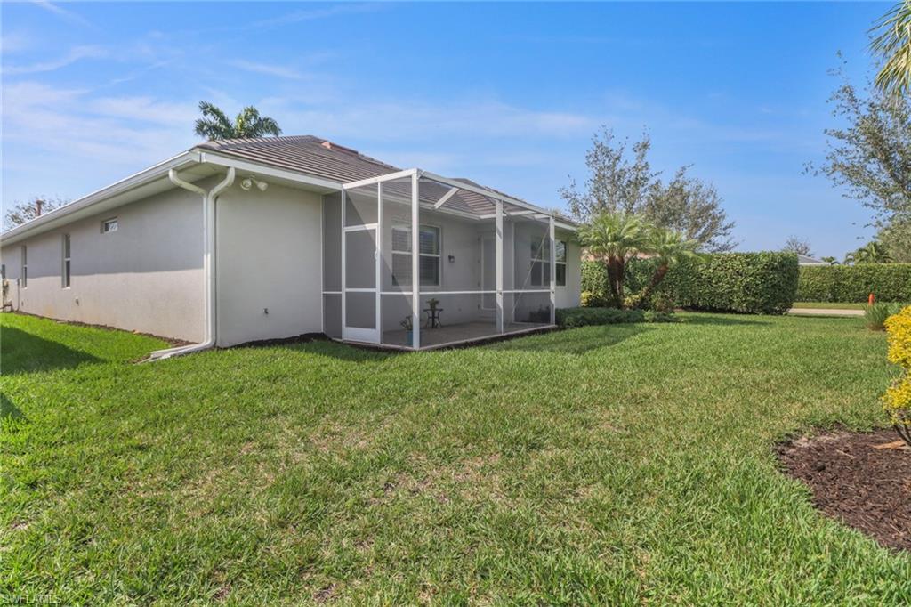 10588 Jackson Square Drive Estero, FL 33928 - Photo 26 of 50 a view of a house with a yard