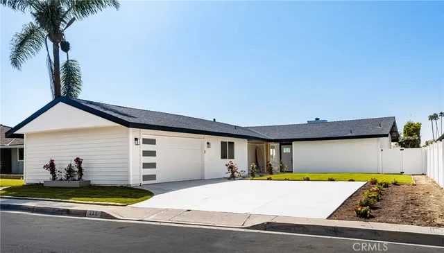 a view of a swimming pool with potted plants
