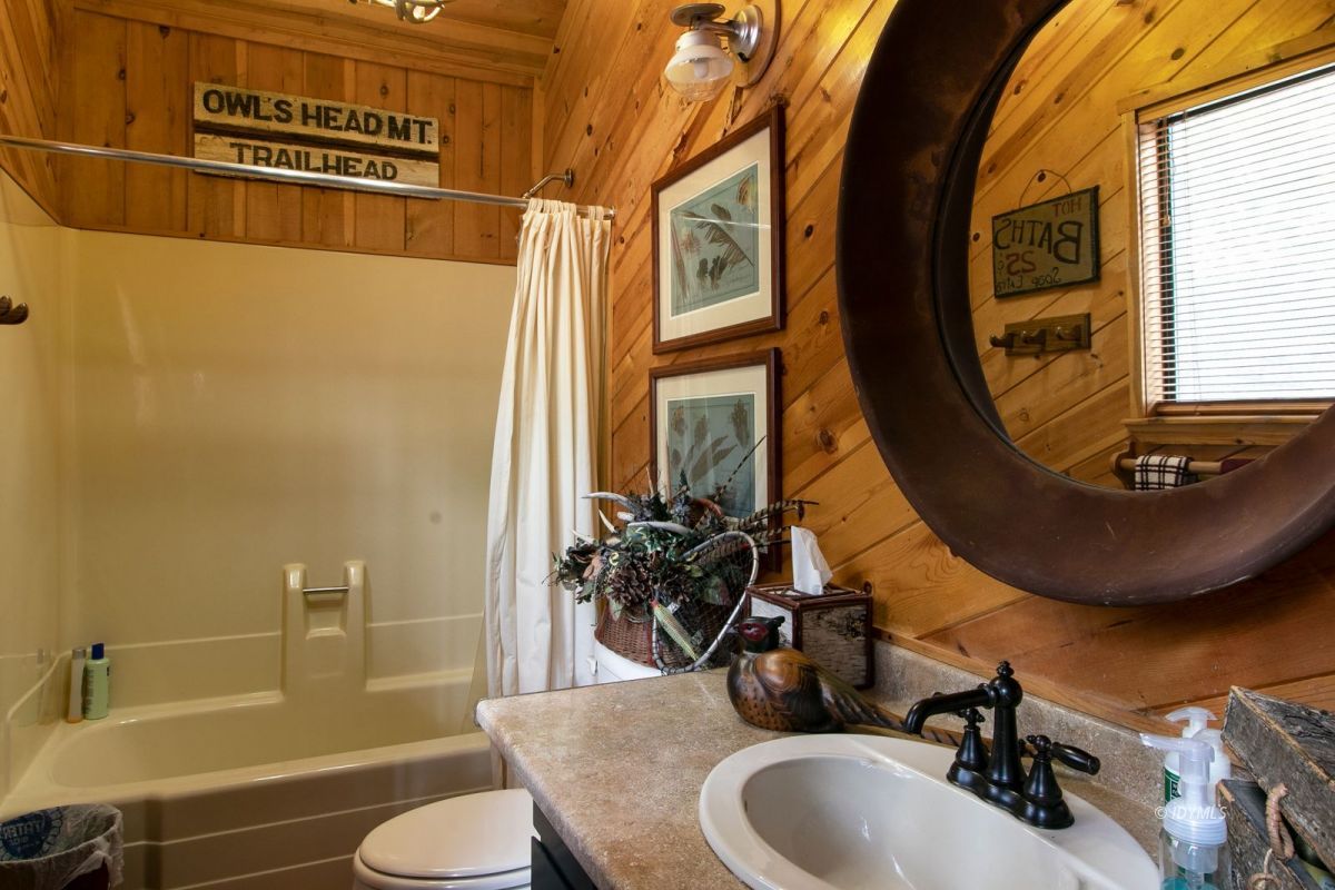 52641 4s02 Idyllwild, CA 92549 - Photo 19 of 36 a bathroom with a sink and a mirror