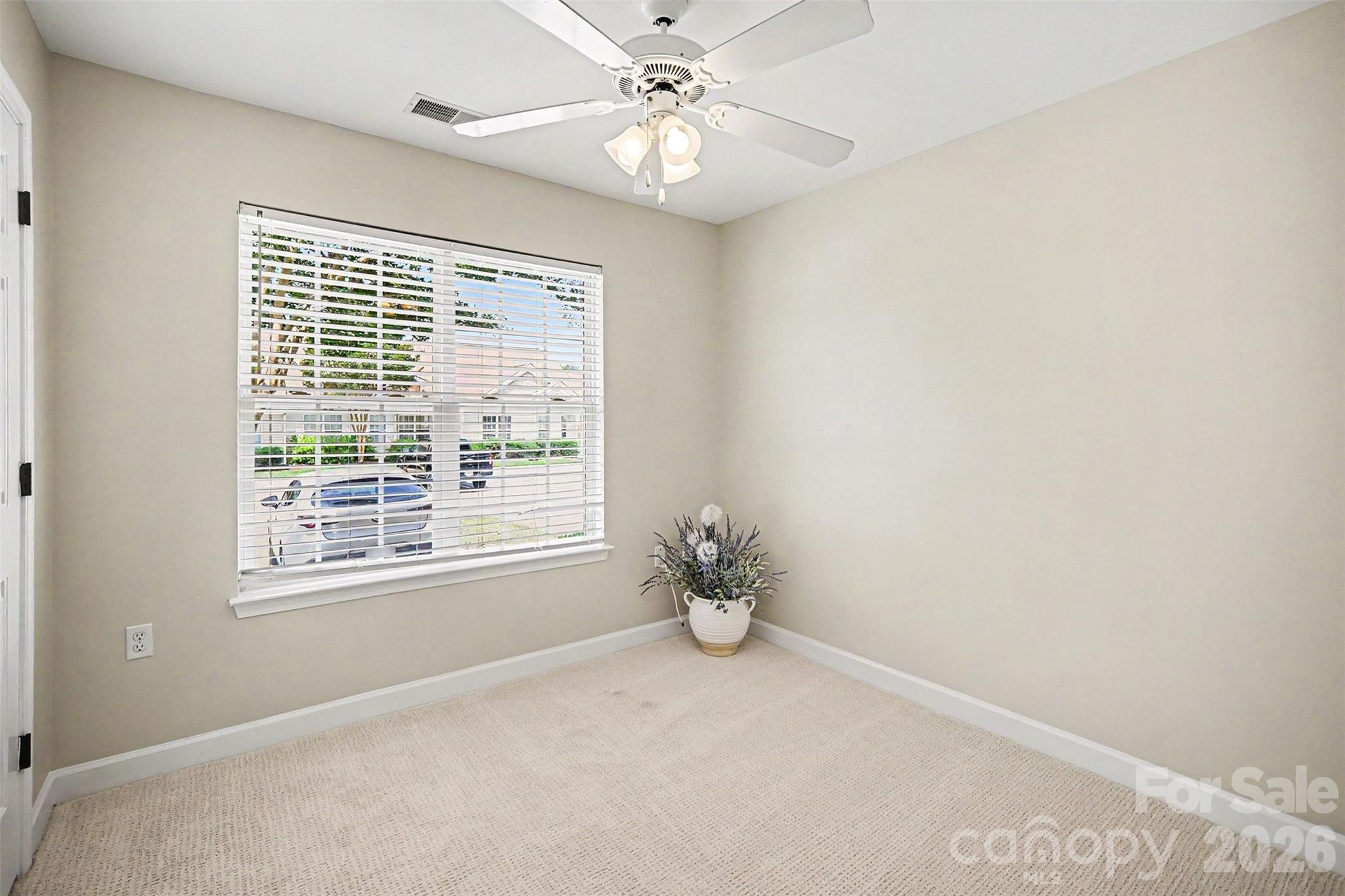 1210 Sheldon Brook Lane Fort Mill, SC 29707 - Photo 19 of 26 a view of wooden floor and chandelier fan in a room