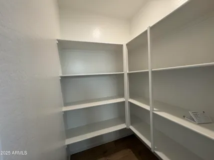 a view of an empty walk in closet