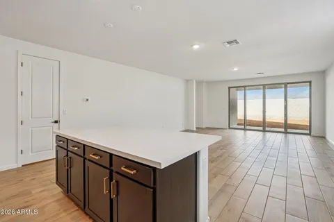 a view of an empty room with closet area
