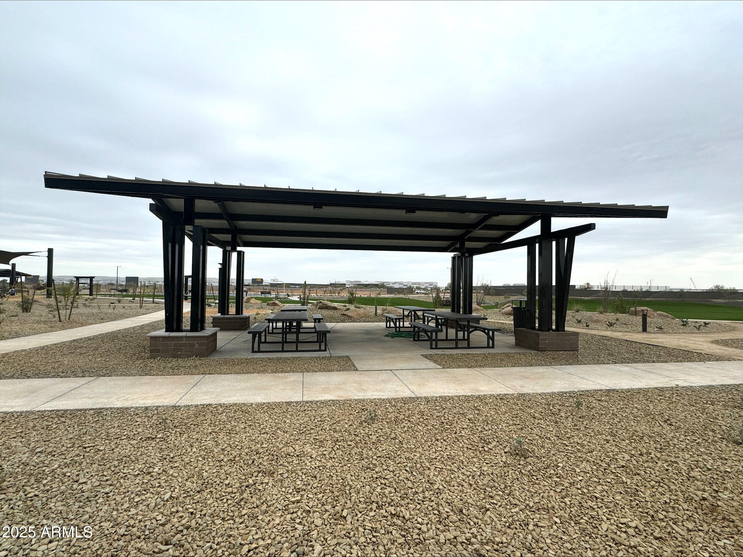 15720 West Camden Avenue Waddell, AZ 85355 - Photo 23 of 32 a view of a swimming pool and an outdoor seating