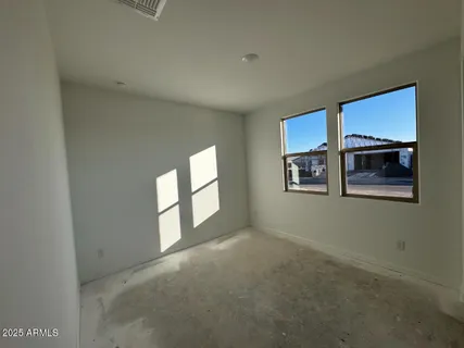 a view of empty room with windows