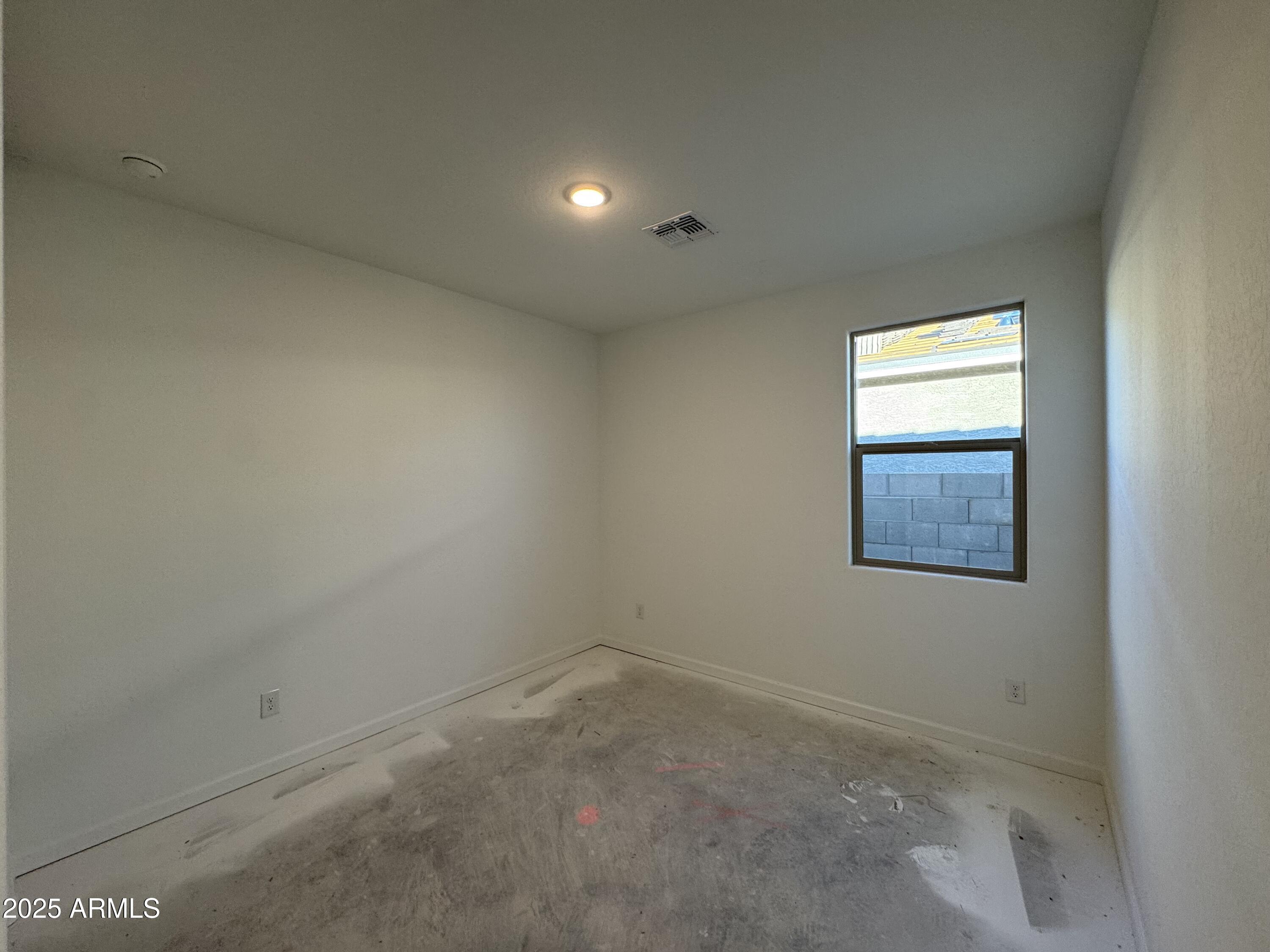 15720 West Camden Avenue Waddell, AZ 85355 - Photo 5 of 32 an empty room with a window