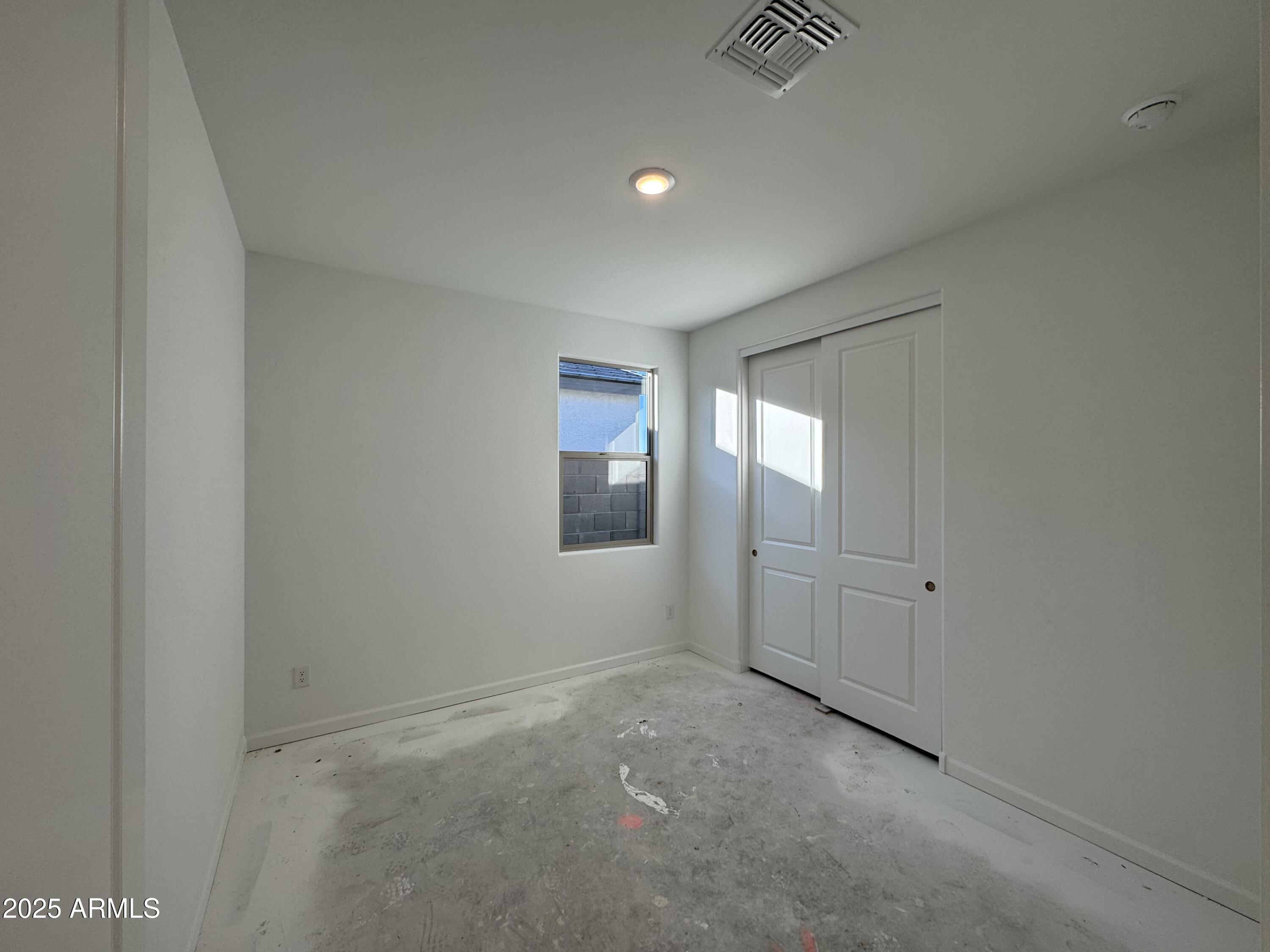 15720 West Camden Avenue Waddell, AZ 85355 - Photo 7 of 32 a view of an empty room and window