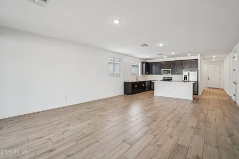 a view of a kitchen with a sink and a window