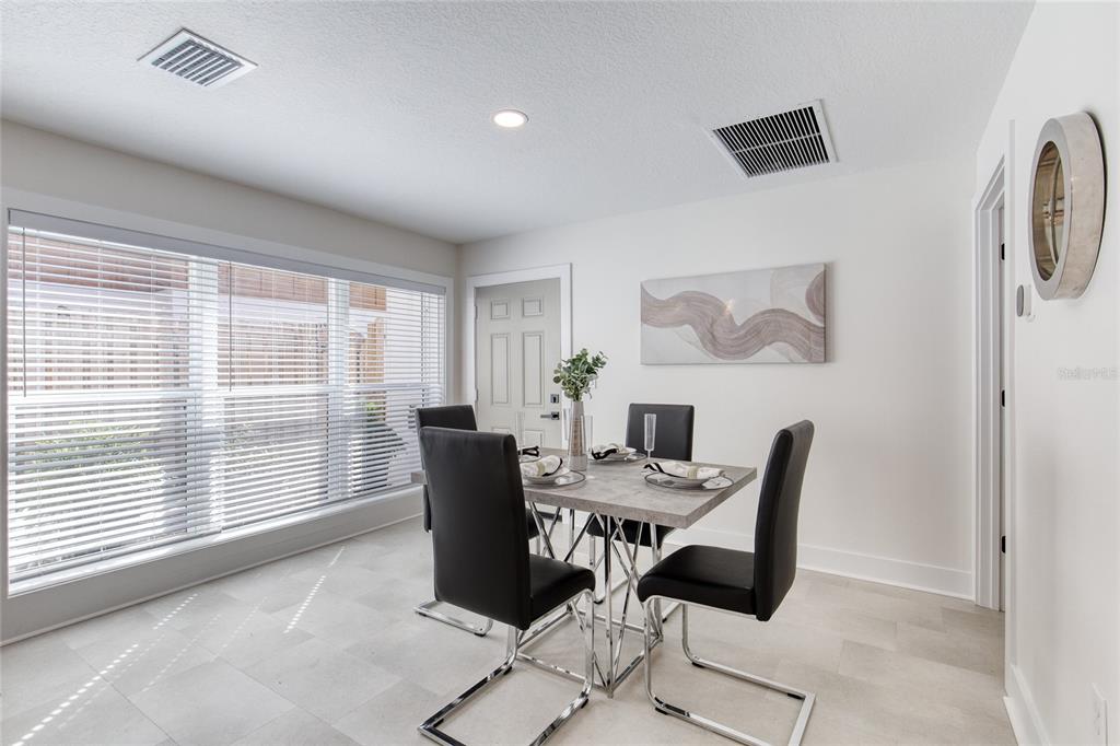 9 Soco Trail Ormond Beach, FL 32174 - Photo 11 of 74 a view of a dining room with furniture and a window