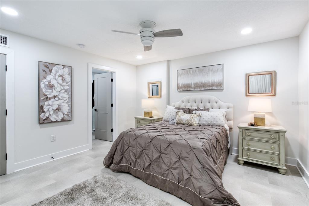 9 Soco Trail Ormond Beach, FL 32174 - Photo 33 of 74 a bedroom with a bed and a painting on the wall
