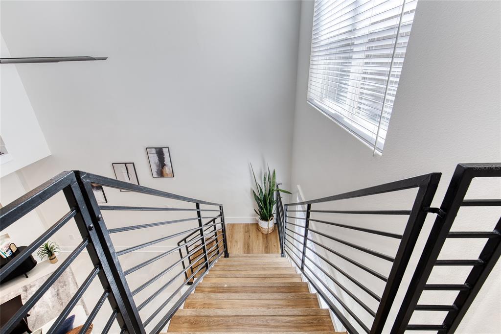 9 Soco Trail Ormond Beach, FL 32174 - Photo 36 of 74 a view of entryway with wooden floor and stairs