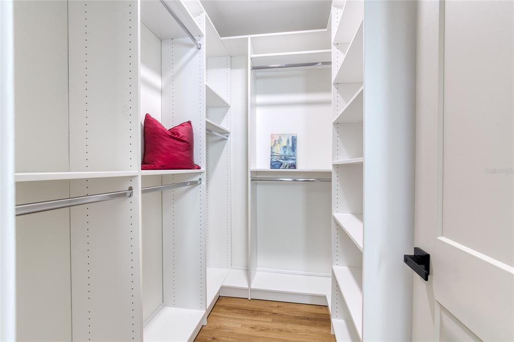 9 Soco Trail Ormond Beach, FL 32174 - Photo 40 of 74 a view of walk in closet with clothes and shoes