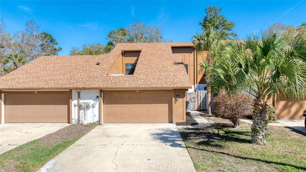 9 Soco Trail Ormond Beach, FL 32174 - Photo 58 of 74 a view of a house with a yard