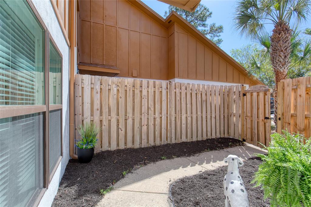 9 Soco Trail Ormond Beach, FL 32174 - Photo 8 of 74 a view of a backyard with potted plants