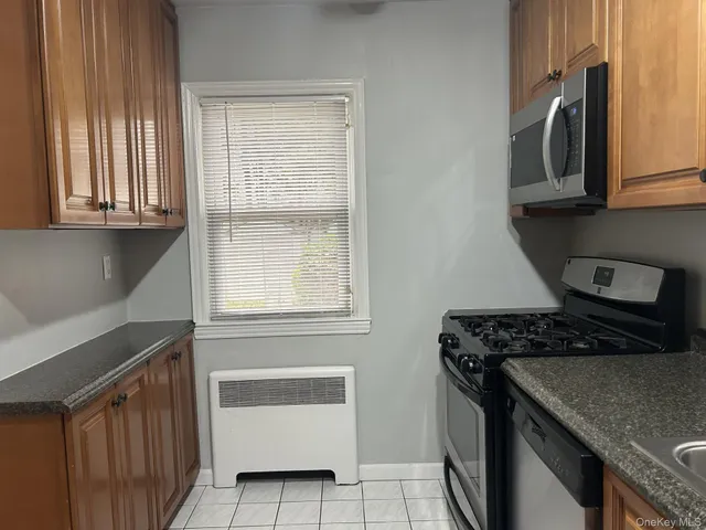 a kitchen with a stove and a microwave