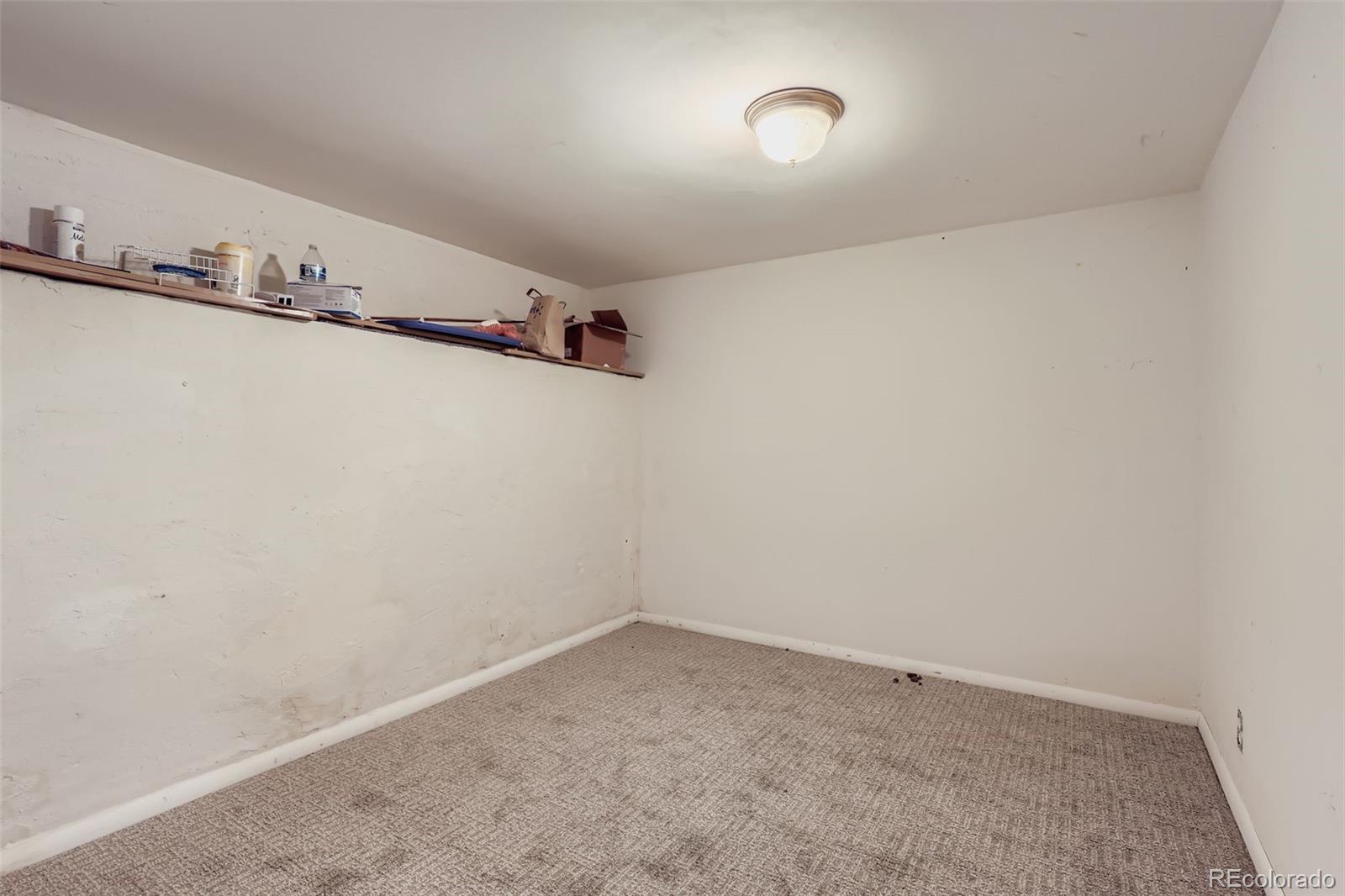 657 Meade Street Denver, CO 80204 - Photo 15 of 17 a view of a room with rack on the wall