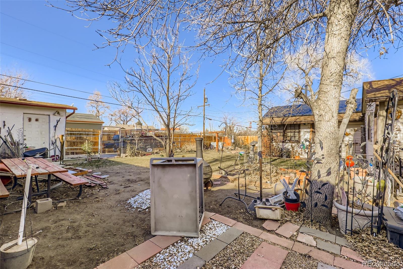657 Meade Street Denver, CO 80204 - Photo 16 of 17 a view of a house with a yard
